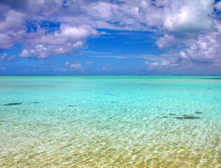 beach with blue sky and clouds