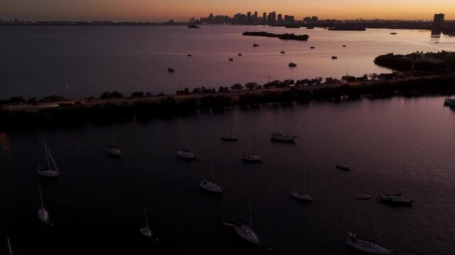 Miami Skyline Sunset over Harbor with Sailboats in Bay 