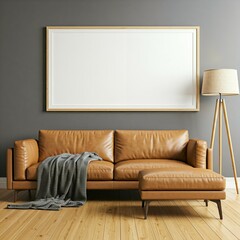 A modern living room features a brown leather sofa, a grey throw blanket, a matching ottoman, a large blank picture frame, and a floor lamp on a wooden floor.