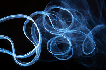 Photography of moving neon light with light trail on dark background, vibrant blue color
