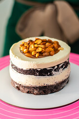 Close-up. The process of making a holiday cake with nuts and caramel.