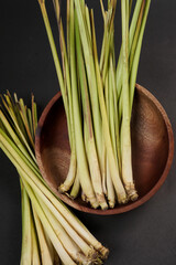 Lemon grass on wooden bowl isolated on white background, high resolution photo.