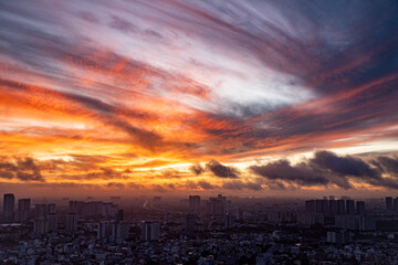 A city skyline with a beautiful orange and pink sky