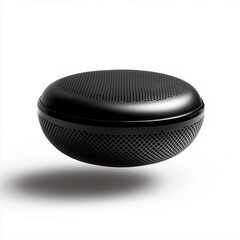 A modern black wireless speaker with a perforated design, resting on a white base, illustrating high-tech sophistication and minimal aesthetic appeal.
