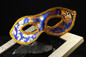 Beautiful bright carnival mask on dark background