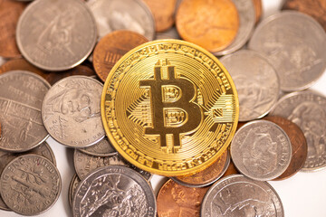 Bitcoin on a pile of American coins