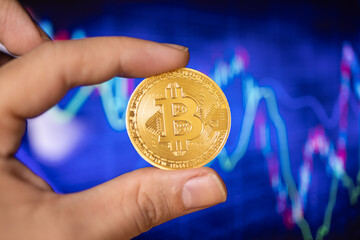 Hand holding Bitcoin