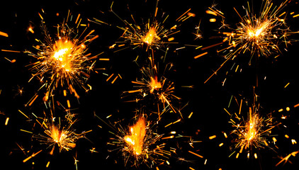 Sparkler spark. Firework spark or black background. Light sparkler. New Year banner or Christmas...