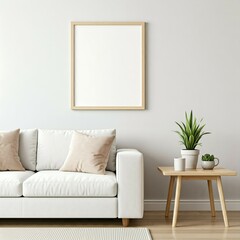A minimalist living room with a white sofa, neutral cushions, a wooden side table with a potted plant and cups, and a blank square picture frame on the wall.