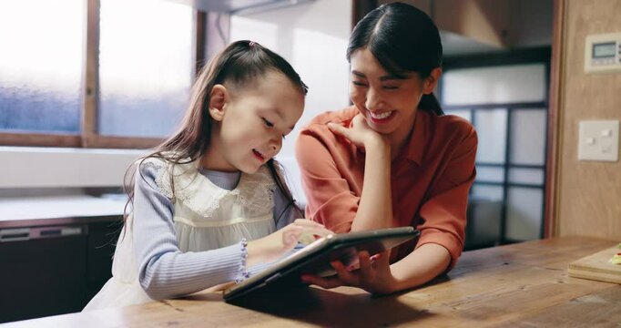 Mother, child and tablet in home for learning, educational media and memory game app. Woman, girl or tech in kitchen for homeschooling, growth or innovative software for Japanese language development