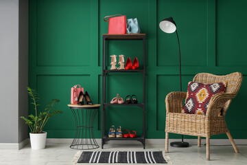 Interior of dressing room with armchair and female shoes on shelves