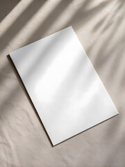 single white poster card placed flat on neutral background, showcasing its clean and minimalistic design. soft shadows add depth and elegance to scene