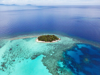 Indonesia Anambas Islands - Drone view Dinkor Island reef around the island