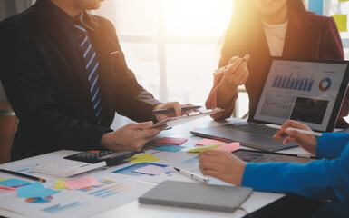 Meeting of business executives discussing analysis of the company's financial situation and business planning with partner collaboration and consultation of strategy.