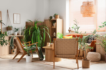 Stylish interior of living room with green houseplants