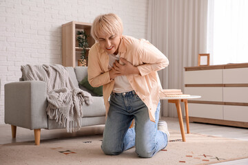 Mature woman having heart attack at  home