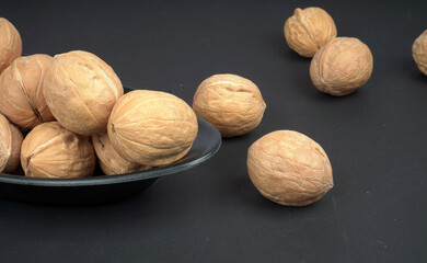 Walnut in Black bowl and Black background