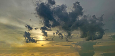 a sunset over the ocean with clouds in the sky, time clouds over the mountains, sunset in the mountains