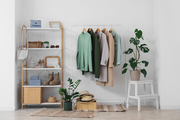 Interior of dressing room with clothes rack and shelf unit