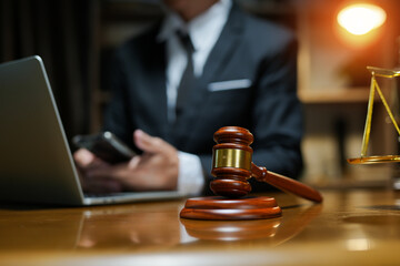 judge on wooden table And experienced lawyers meet with clients and give advice behind the scenes. legal services legal consulting concept