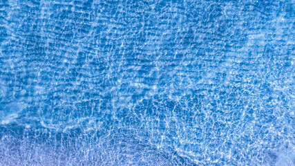 Nature of the beach and water sea Summer with sunshine, sandy beaches, clear blue waters sparkling against the blue sky. On an island with good ecology and environment Background for summer vacation