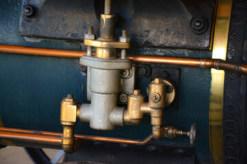 Close-up of the hydraulic system of an old locomotive, showcasing intricate metal components and...