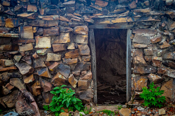 Old house in ruins at sunset framed by a tree, in Rancho Los Cardos in Monte Escobedo, Zacatecas