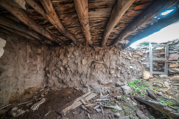 Old house in ruins at sunset framed by a tree, in Rancho Los Cardos in Monte Escobedo, Zacatecas