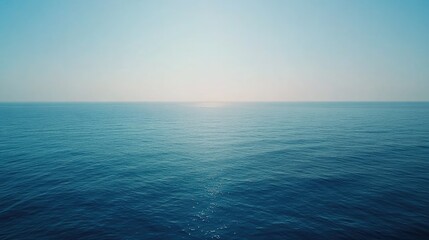 Obraz premium Wide shot of offshore wind turbines on the ocean horizon, contributing to sustainable energy production with a peaceful ocean backdrop
