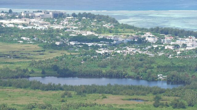 Susupe Lake with Chalan Kanoa and Susupe Villages in view, aerial footage, Saipan, Northern Mariana Islands
