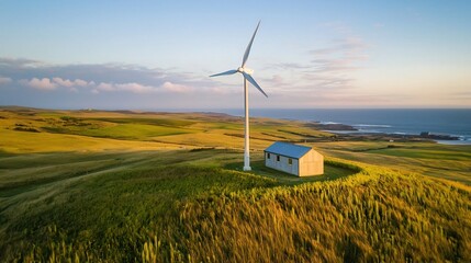 Innovative small scale wind turbine standing tall in a picturesque countryside landscape providing renewable energy solution for residential homes and buildings