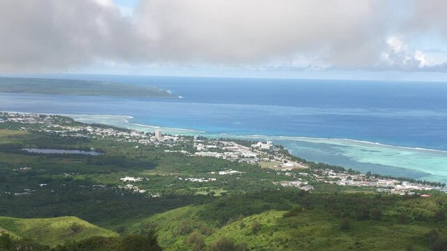 Hand-held footage of the west coast of Saipan,  with Garapan and Susupe, and Tinian Island in the far distance.    