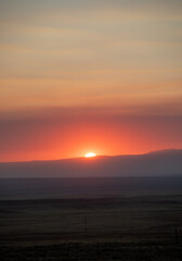 Red sunset layers of colour in clouds 