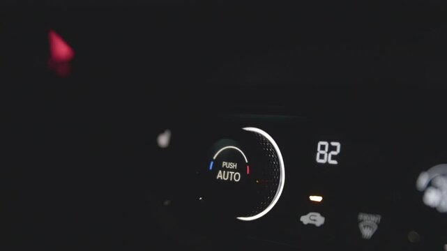driver adjust air temperature climate condition to control automatic condition in modern luxury vehicle for drive transportation at night