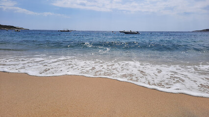 Waves on the beach. Natural background at the summer time