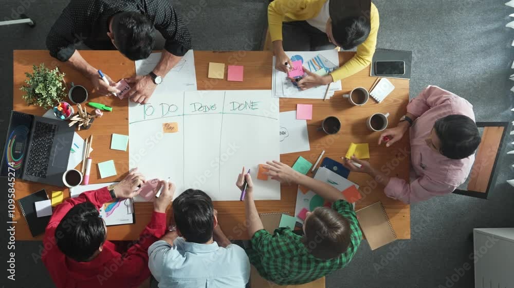 Poster top down aerial view of diverse business team making scrum task board at meeting room. group of smar