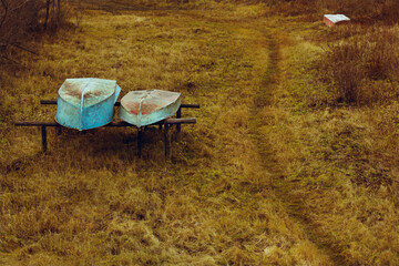 Fishing Boats in Tall yellow Grass on the Shore