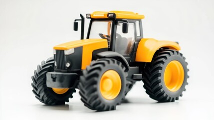 Obraz premium Yellow Toy Tractor on White Background