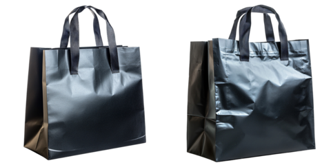 A black matte paper shopping bag with thick ribbon handles isolated on white and transparent background