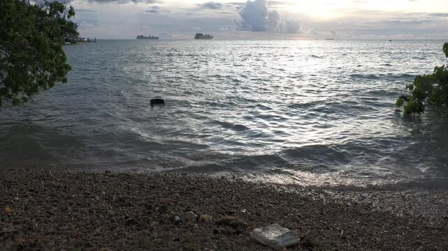 After sunset view at the Fishing Base in Saipan, CNMI with preposition ships in the distance, steady footage