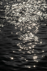 Sun reflection of waved water surface
