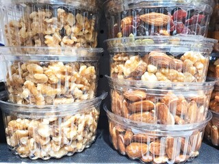 Pre-packed Mix nuts for sale. A variety of assorted pre-packed mix nuts and raisins in plastic packing on sale
