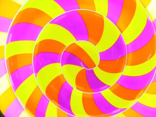 Obraz premium Round rainbow lolipop object on bright back lighting