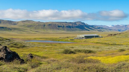 Fototapeta premium Scenic Landscape with Mountains, Grasslands, and Water Body in Iceland