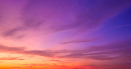 Twilight sky background with sunset clouds and natural gradient light on colorful evening horizon sky backdrop