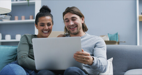 Home, sofa and couple with laptop for comedy, streaming and bonding together with entertainment. Happy people, man and woman with laughing for digital joke, watching movie and connection in marriage
