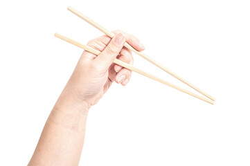 Female hand holding a wood chopstick isolated on white background.