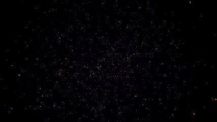 A dark space with small red sparks flying upward surrounded by blue sparks in all directions, explosion, flashing lights, blue sparks