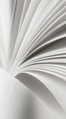 Close-up of an open book's pages fanning out.