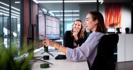 Analyst Employee Working On Spreadsheet